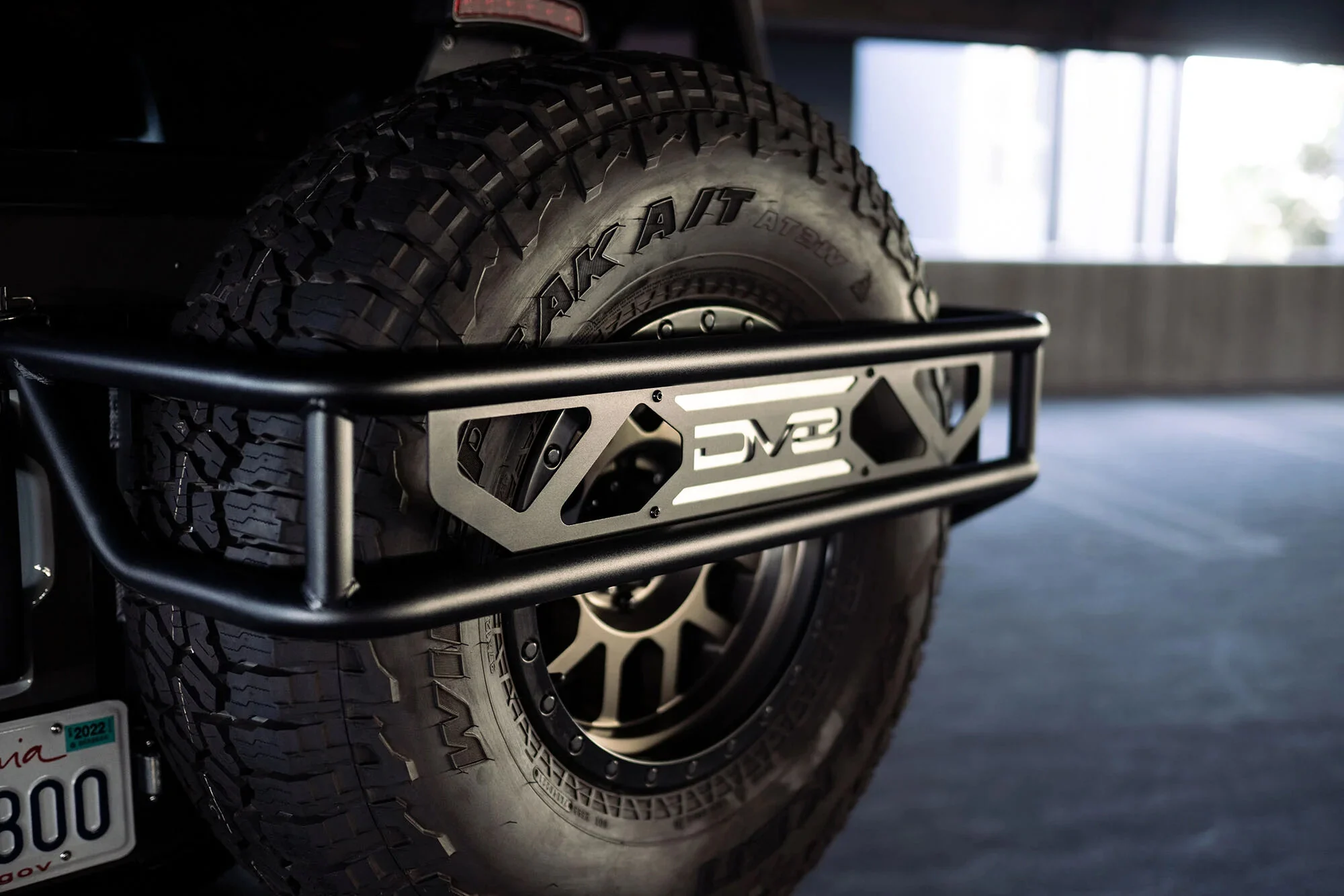 DV8 Offroad TCBR-01 Spare Tire Guard & Accessory Mount for 21-26 Ford Bronco